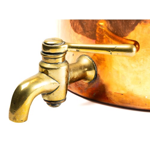 673 - A 19th century copper vessel, the boiler and cover fitted two handles each, having a brass tap, 33cm... 