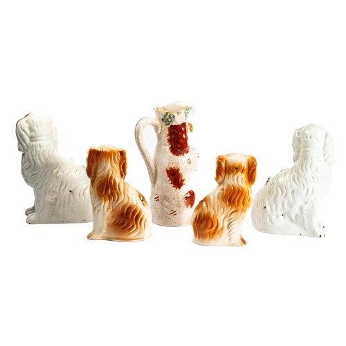 539 - Staffordshire, a range of Staffordshire spaniel figures, four dogs and one jug. Five total. (5)