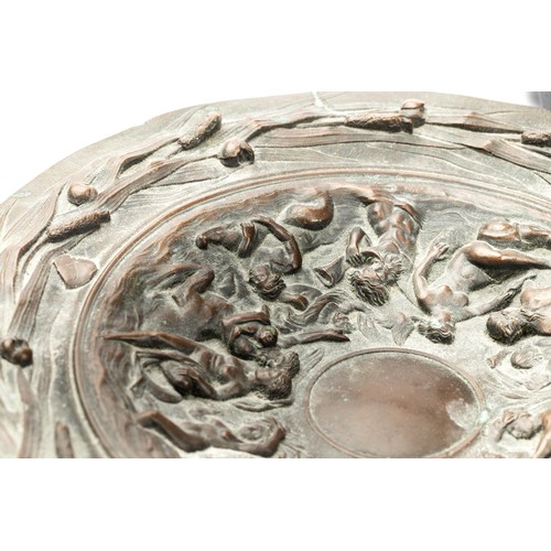 649 - A late 19th century cast bronze tazza, decorated with Poseidon and cavorting figures, within a bullr... 