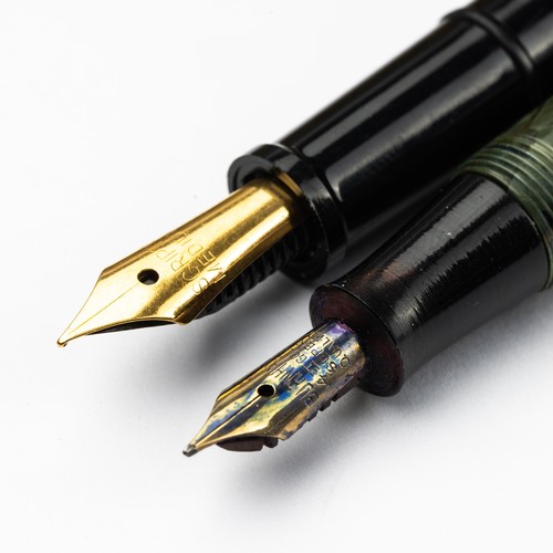 788 - Five Pens - A Burnahm fountain pen with a 14ct gold nib, a boxed pair of Scripto pens and a cased pa... 