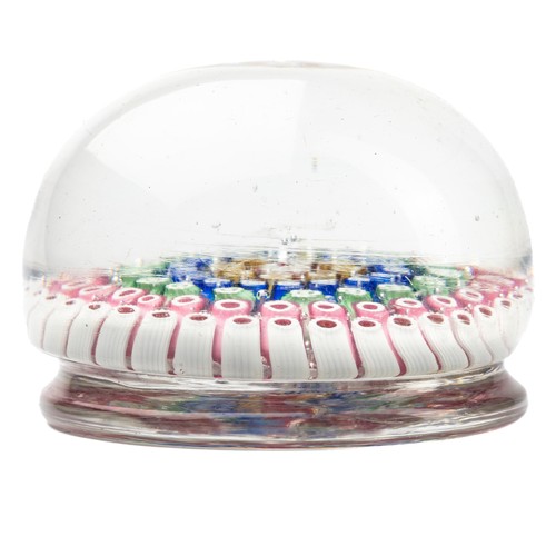 640 - A millefiori glass paperweight, having concentric rings of coloured canes, raised on a ring turned b... 