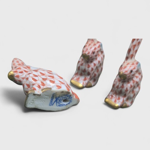 521 - Herend, a Herend Hungary porcelain set of three miniature Rabbits (one with broken ear). Heights 5.5... 