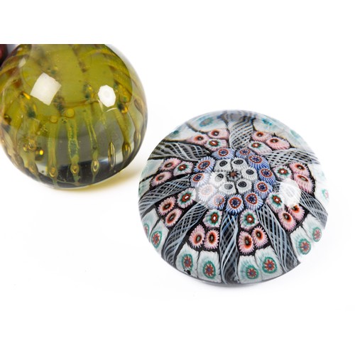 642 - A collection of nine glass paperweights, includes a Caaithness titled 