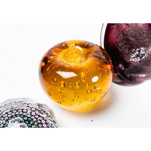 642 - A collection of nine glass paperweights, includes a Caaithness titled 