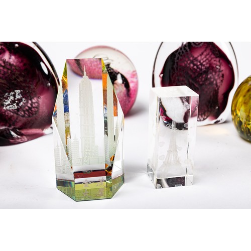 642 - A collection of nine glass paperweights, includes a Caaithness titled 
