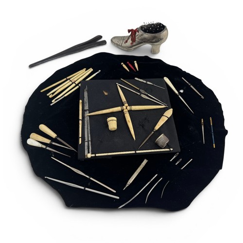 658 - Collection of antique bone bodkins and other sewing implements, too include a white metal pin cushio... 