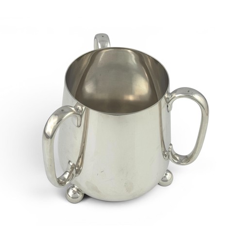 651A - A silver plated tyg on three ball feet, 17cm high. No inscriptions.