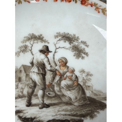 546 - A Meissen porcelain lidded cup and saucer, en grisaille painted decoration of peasant figures in lan... 