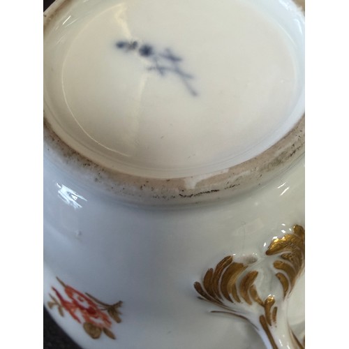 546 - A Meissen porcelain lidded cup and saucer, en grisaille painted decoration of peasant figures in lan... 