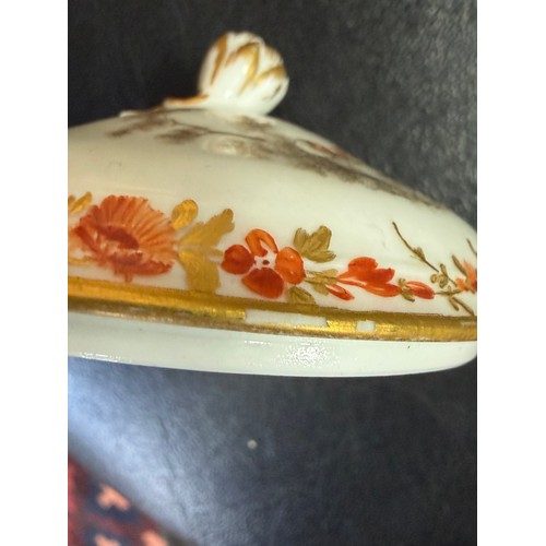546 - A Meissen porcelain lidded cup and saucer, en grisaille painted decoration of peasant figures in lan... 