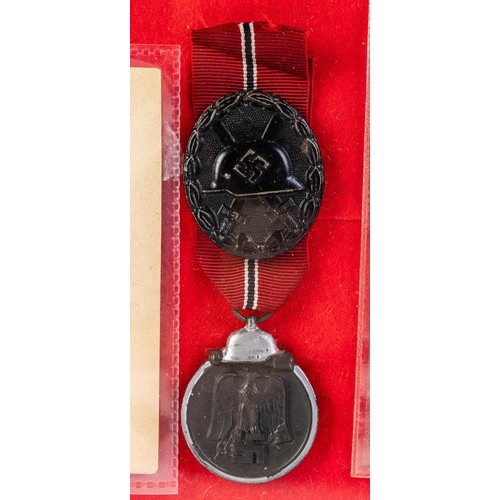 535 - Third Reich range mounted in a modern frame with 1941 Eastern Front Medal, Black Wound Badge, 3 post... 
