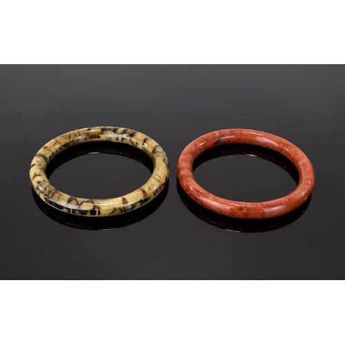 361 - A Pair Of Vintage Agate Effect Bangles Two in total, the first in brick red tone with striated detai... 