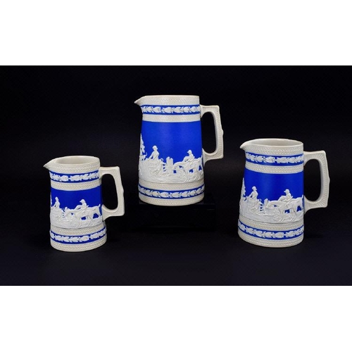 524 - Set of Three Copeland Spode Graduated Blue and Cream Stoneware Jugs, each showing a panoramic huntin... 