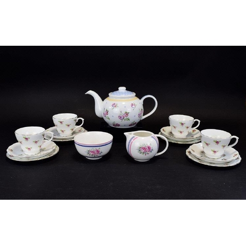 563 - Pretty Floral Tea Set, comprising teapot, 4 cups, 4 saucers & 4 side plates together with a milk jug... 