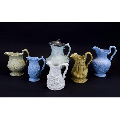 603 - A Good Collection of Late 18th Century to Mid 19th Century Moulded Jugs, Decorated In High Relief. S... 