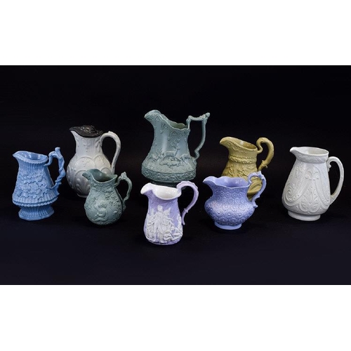 604 - A Very Good Collection of Mid 19th Century Moulded Jugs Decorated In High Relief ( 8 ) Jugs In Total... 