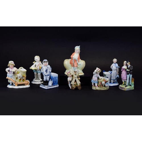 628 - A Collection of Late 19th Century Hand Painted Ceramic Figures and Figural Match Holders / Strikers.... 