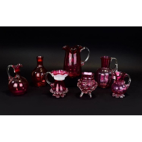 760 - Seven Pieces Of Cranberry Glass, To Include Small Vases And Jugs