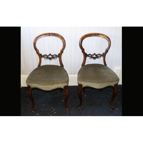 1034 - A Pair of Walnut Parlour/Salon Chairs balloon back with padded seats.