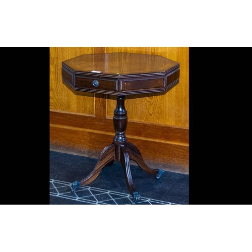 1043 - A Mid Twentieth Century Mahogany Octagonal Pedestal Table Two frieze drawers, turned supports, brass... 