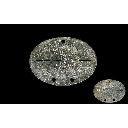 1324 - WWII Interest Original SS Panzar Art Reg Totenkopf Dog Tag Oval tag with aged patina. 3 inches in wi... 