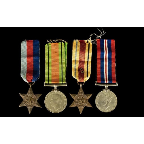 1328 - A Collection of World War II Military Medals ( 4 ) In Total. Comprises 1/ The Africa Star. 2/ 1939 -... 