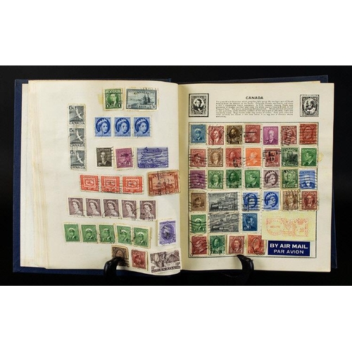 1434 - Blue Universal Stamp Album well filled with stamps mostly from Victorian times to 1950's. Also conta... 