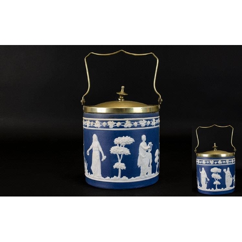 632 - Jasper Ware Blue and White Biscuit Barrel with silver plated lid and handle. The barrel decorated wi... 