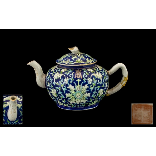 866 - A Small Chinese Teapot in the Famille Rose decoration, Republic period. Character marks to base. Dam... 