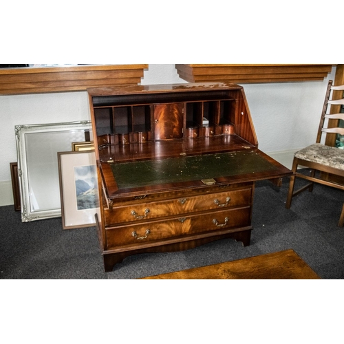 1053 - A Georgian Style Mahogany Bureau the fall front with green tooled leather top, fitted interior with ... 