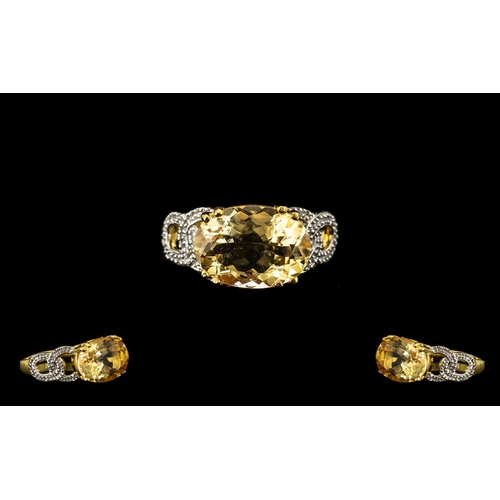 202A - Citrine East-West Set Solitaire Ring, an oval cut citrine of 5cts set across the finger, East-West s... 