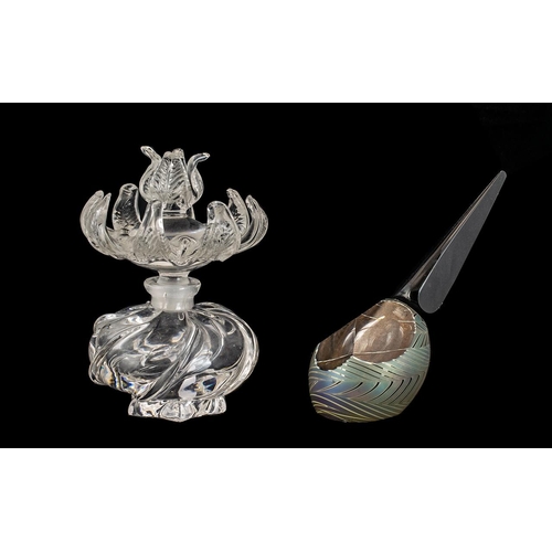 730 - Two Decorative Glass Scent Bottles, comprising a round glass bottle with very decorative flower shap... 