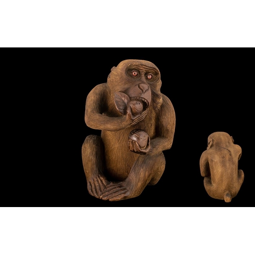 802 - Japanese Meiji Period Carving of a Monkey Eating a Peach, of unusually large size, with finely detai... 