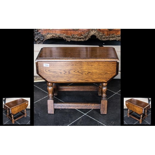 1010 - Small Oak Reproduction Drop Leaf Table on turned legs; approx. 20 inches (50cms) high