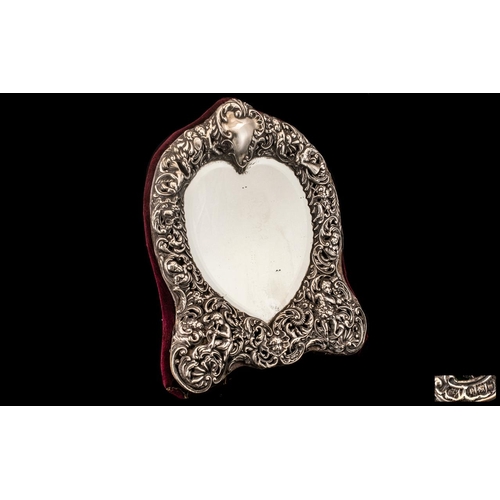 104 - Large Victorian Silver Bedroom Mirror, dated London 1901, Maker W.C.  Decorated with cherubs, David ... 