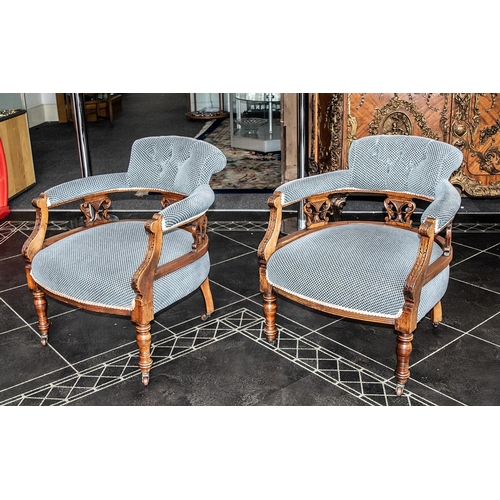 1043 - A Pair of Victorian Tub Chairs with padded back rests, arms and seats. Carved supports on turned leg... 