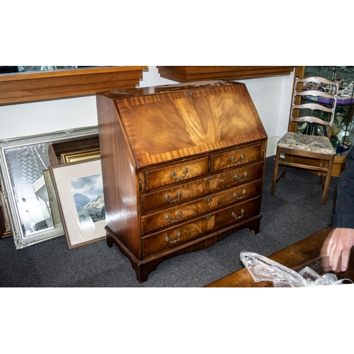 1053 - A Georgian Style Mahogany Bureau the fall front with green tooled leather top, fitted interior with ... 