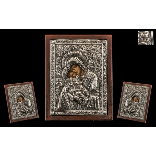 312 - Russian / Greek Stamped Silver Embossed Icon, Depicting Mary and Child with a Painted Face, Wood Bac... 