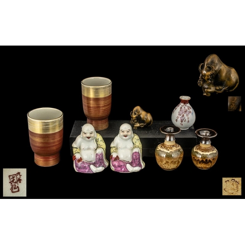 830 - A Miscellaneous Collection of Oriental Items to include a Famille Rose Buddha, two pairs of vases, a... 