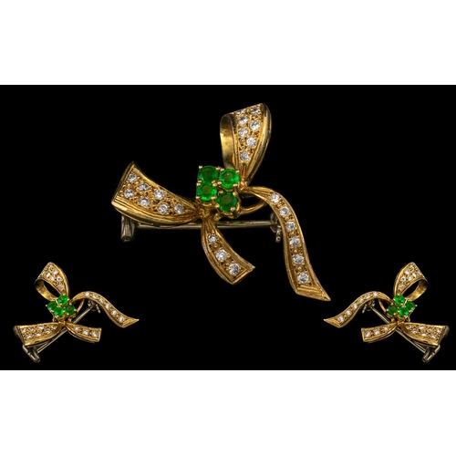 203 - 18ct Gold - Attractive Emerald and Diamond Set Bow Brooch. Marked 18ct - 750. The Round Faceted Emer... 