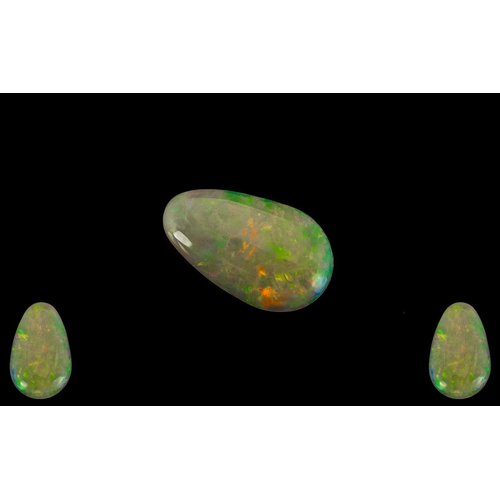 220 - Ethiopian Natural Pear Shaped Green / Orange Opal. 3.07 cts. Measurements 20.1 x 12.2 x 3.3 mm.