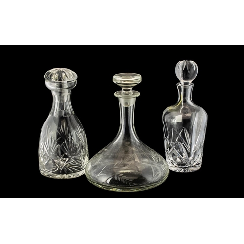 792 - Collection of Three Large Decanters, comprising a Waterford Crystal 'Marquis' decanter, 11'' tall; a... 