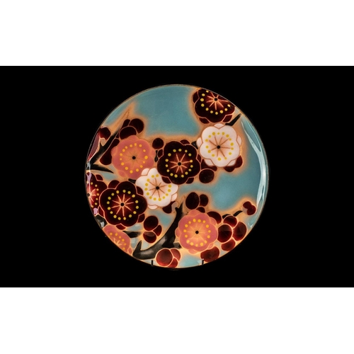 818 - Japanese Ando Enamel Dish with original label; decorated with flowers; 11 inches (27.5cms) in diamet... 