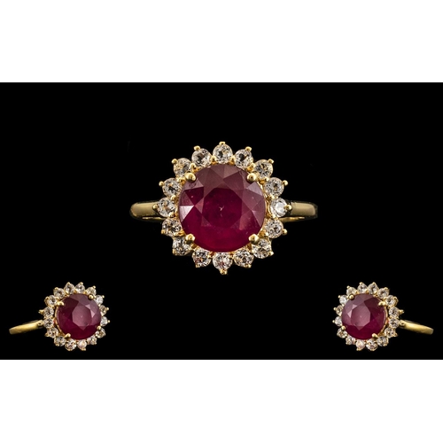 197 - Ruby and White Topaz Halo Ring. A Round Cut Ruby of 5.5 cts, and of Good Bright Colour, Framed by 1c... 