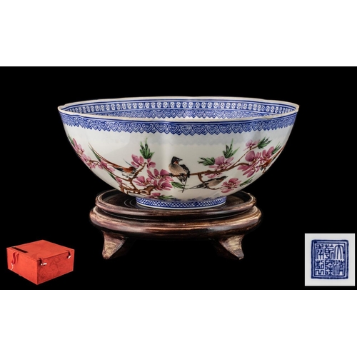 827 - An Oriental Eggshell Porcelain Bowl in original box and complete with wood stand.