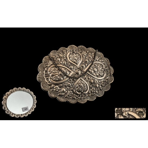 333 - Turkish Silver Embossed Ottoman Design Shaped Hand Mirror, decorated to the body with flowers in gar... 