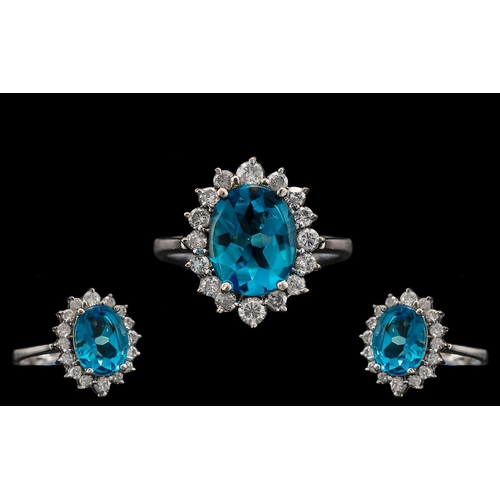 12 - 18ct White Gold - Attractive and Quality Blue Topaz and Diamond Set Cluster Ring. The Central Blue T... 