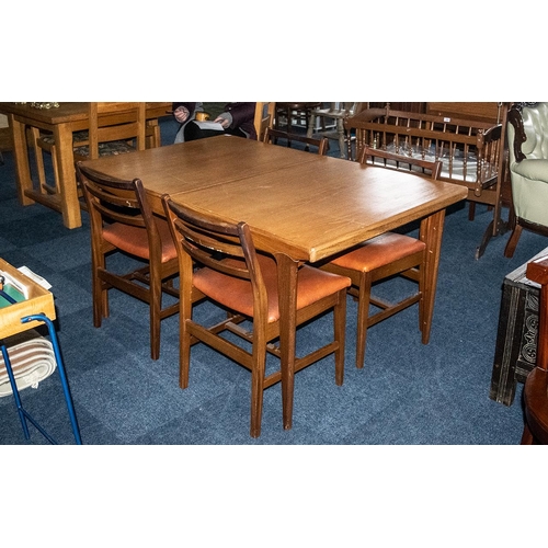 1073 - Teak Table With Pull Out Extending Leaf in the G Plan style, measures 57'' in length, 35''width and ... 