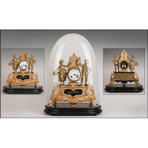 1104 - Antique French Gilt Metal Mantle Clock under a glass dome.  The central clock flanked by a loving co... 