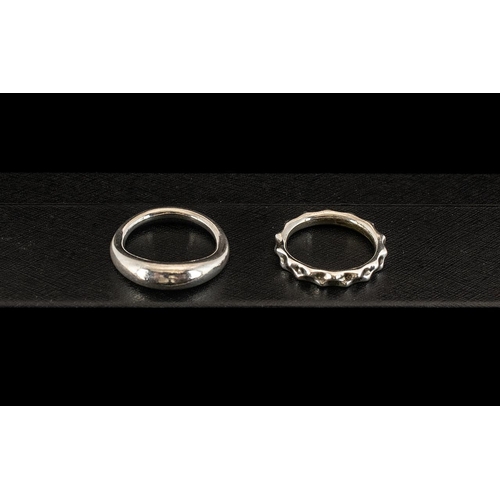 140 - Two Sterling Silver Pandora Rings comprising a twirling band ring marked 925 ALE ring size K, and a ... 